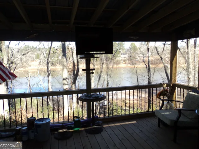 a view of a chairs and table in wooden floor