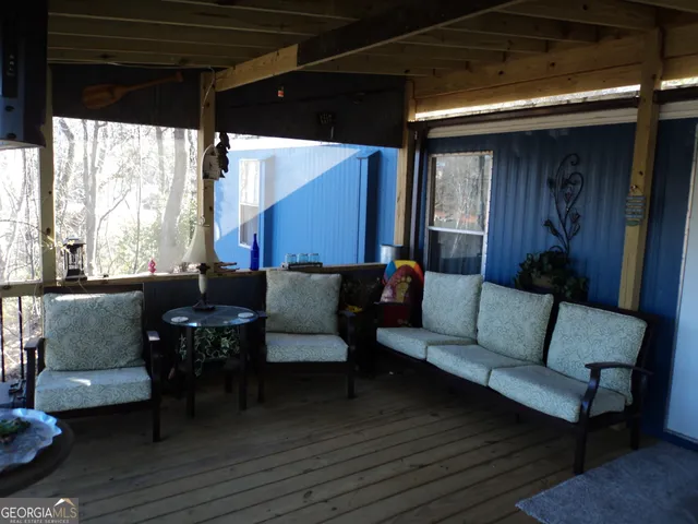 a outdoor living space with furniture and a potted plant
