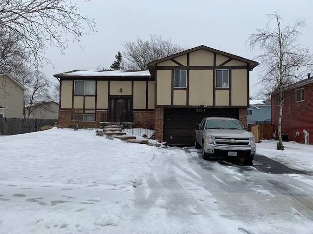 304 Thistle Drive Bolingbrook, IL 60490 - Photo 1 of 9 a car parked in front of a house