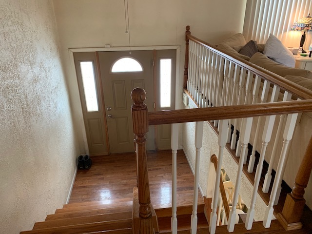 304 Thistle Drive Bolingbrook, IL 60490 - Photo 2 of 9 a view of staircase with railing and a rug