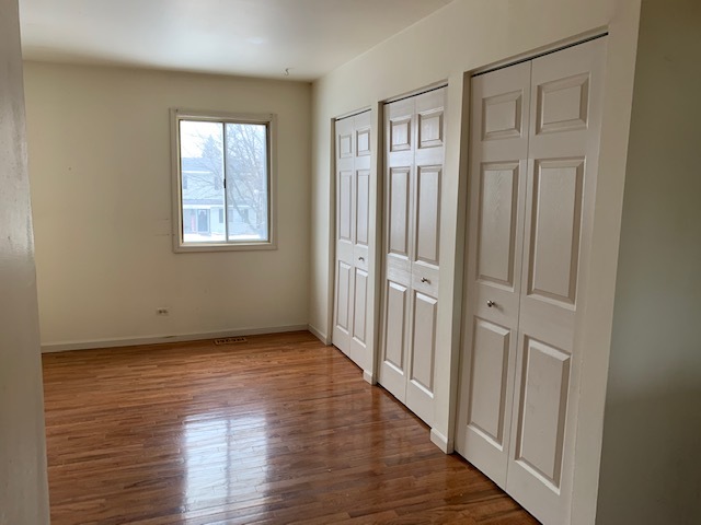304 Thistle Drive Bolingbrook, IL 60490 - Photo 4 of 9 a view of a livingroom with wooden floor and window