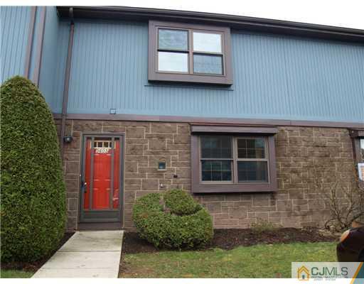 5605 Hana Road Edison, NJ 08817 - Photo 1 of 23 a front view of a house with a garden