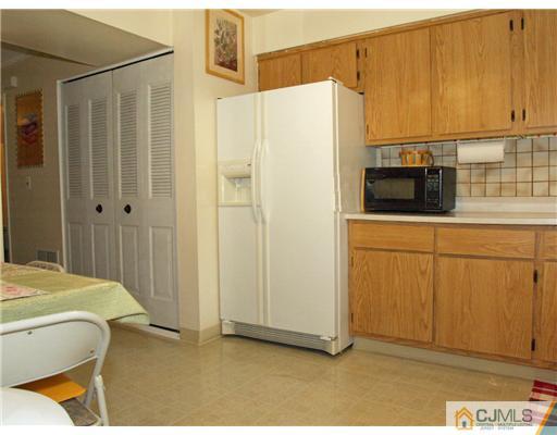 5605 Hana Road Edison, NJ 08817 - Photo 14 of 23 a bathroom with a sink and stainless steel appliances