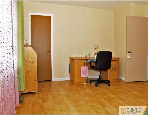 5605 Hana Road Edison, NJ 08817 - Photo 19 of 23 a view of workspace with stainless steel appliances wooden floor and chair