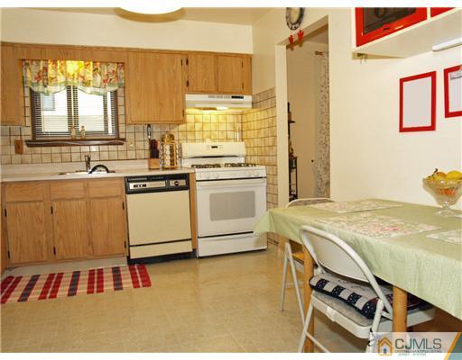 5605 Hana Road Edison, NJ 08817 - Photo 5 of 23 a kitchen with a sink appliances and cabinets