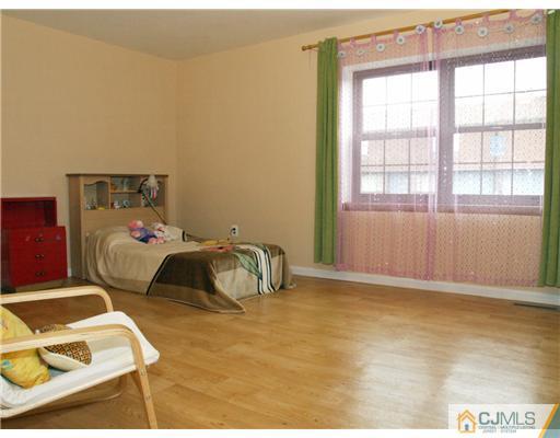 5605 Hana Road Edison, NJ 08817 - Photo 8 of 23 a bedroom with a bed and a window