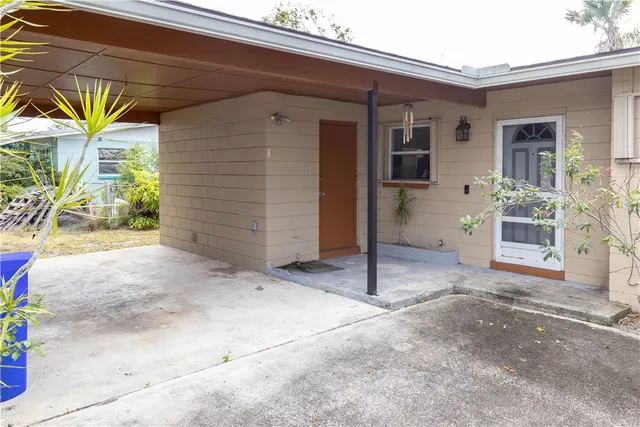 a view of front door and yard