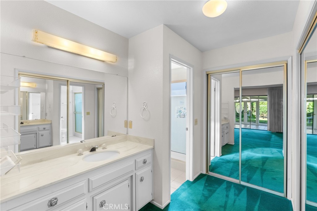 4347 Manchester Court Santa Maria, CA 93455 - Photo 25 of 40 a spacious bathroom with a shower sink and mirror