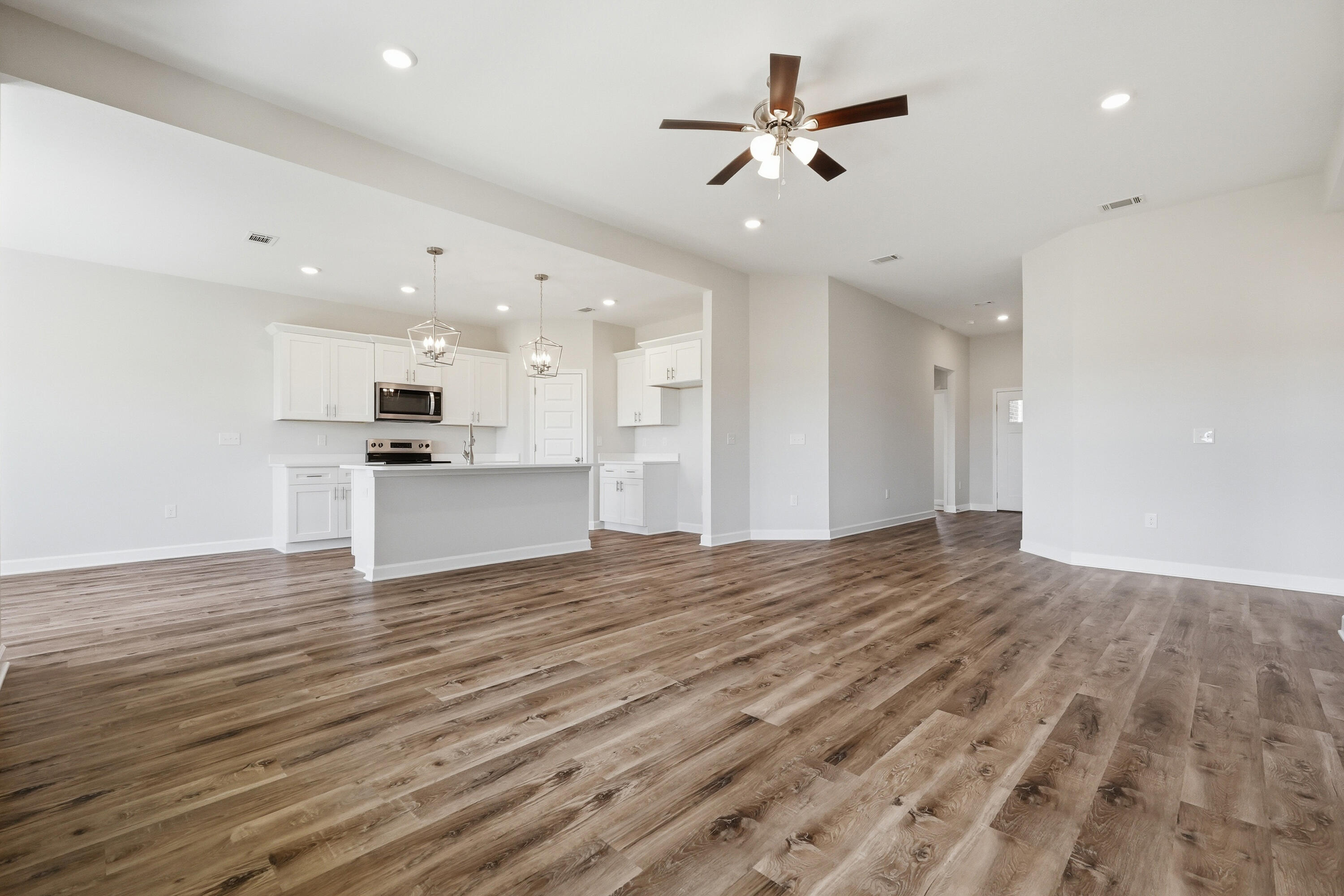 6114 Mildreds Way Crestview, FL 32539 - Photo 5 of 24 a view of a kitchen with a sink and a stove top oven