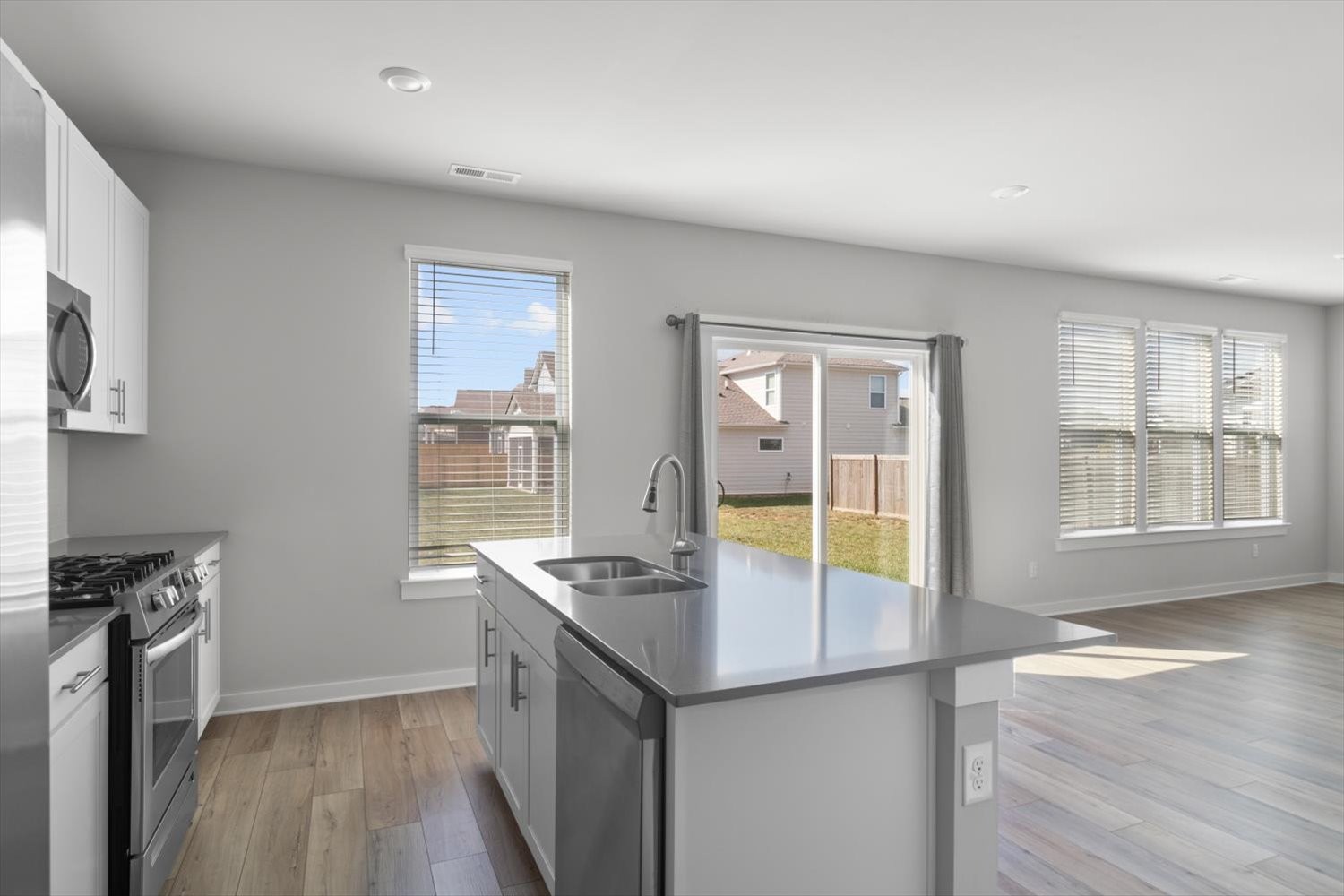910 Sassafras Ct Spring Hill Spring Hill, TN 37174 - Photo 9 of 20 a kitchen with stainless steel appliances granite countertop a sink stove and refrigerator