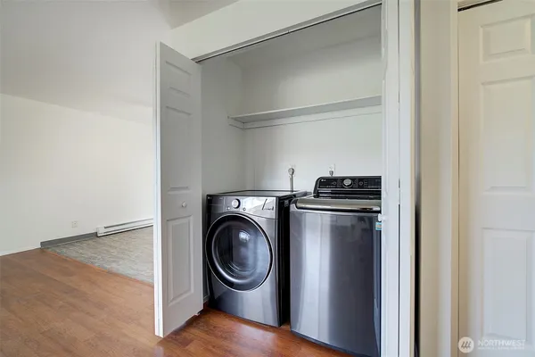 a utility room with washing machine