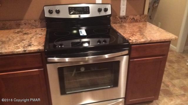 1609 Clover Road North Long Pond, PA 18334 - Photo 24 of 24 a stove top oven sitting inside of a kitchen