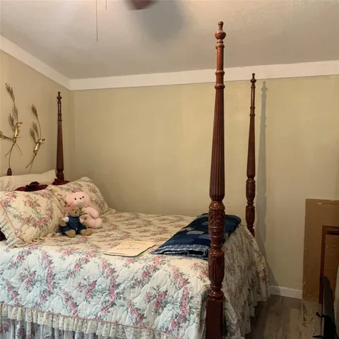 a bedroom with a bed and a mirror