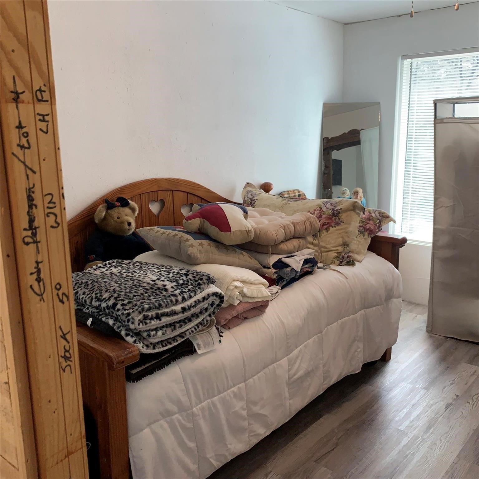 480 Sportsman Drive Trinity, TX 75862 - Photo 18 of 33 a bedroom with bed and wooden floor