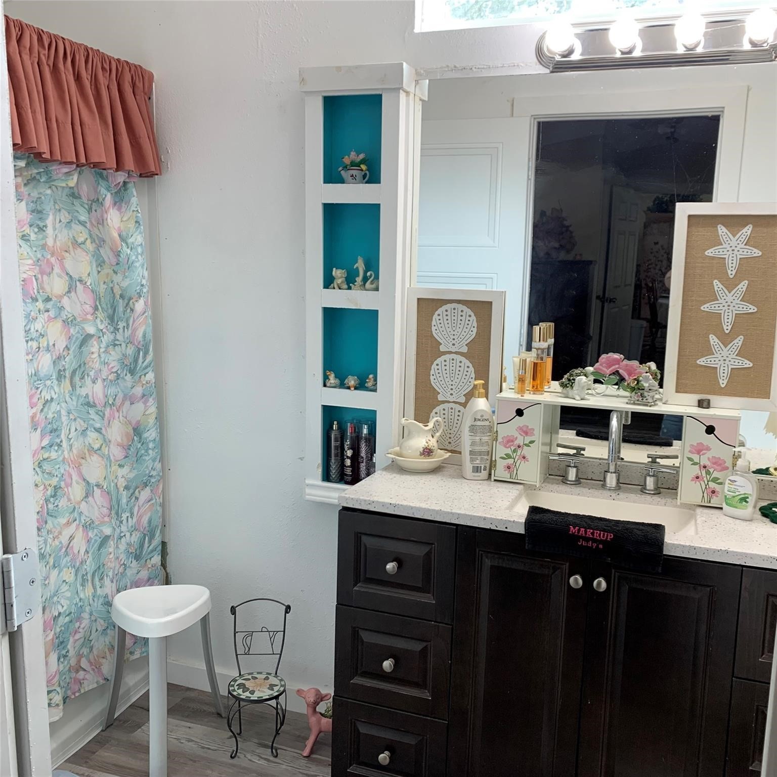 480 Sportsman Drive Trinity, TX 75862 - Photo 23 of 33 a bathroom with a sink and a mirror