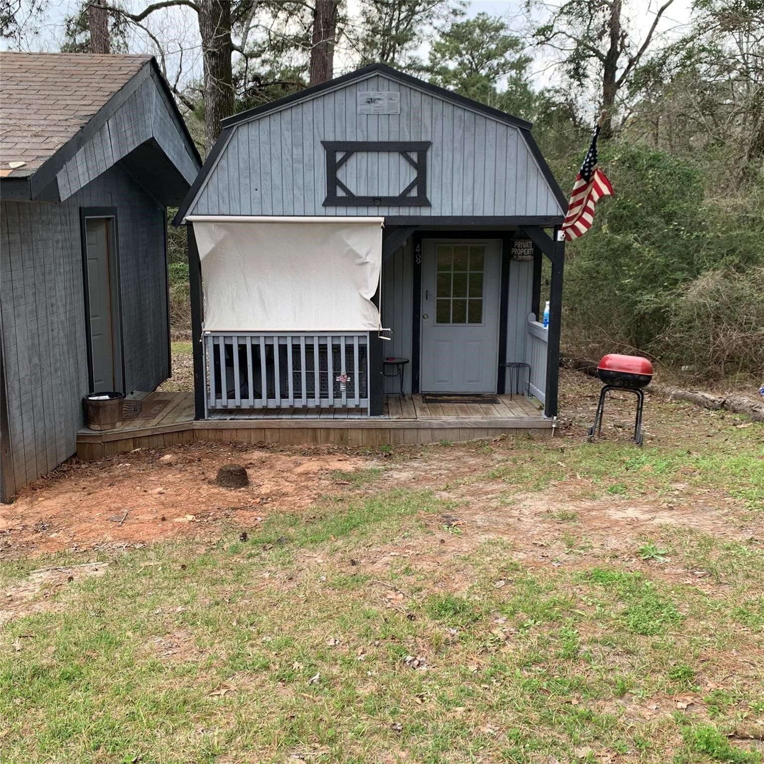 480 Sportsman Drive Trinity, TX 75862 - Photo 25 of 33 a backyard of a house with table and chairs