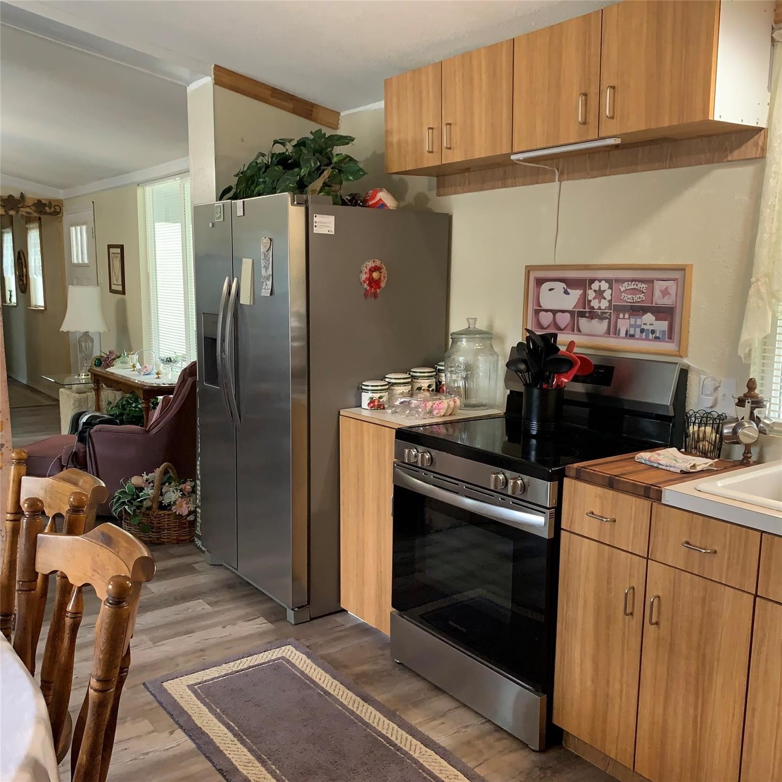 480 Sportsman Drive Trinity, TX 75862 - Photo 6 of 33 a kitchen with stainless steel appliances a stove microwave and refrigerator