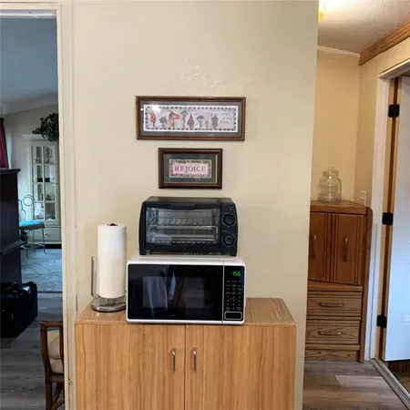 a kitchen with stainless steel appliances a refrigerator and a stove top oven