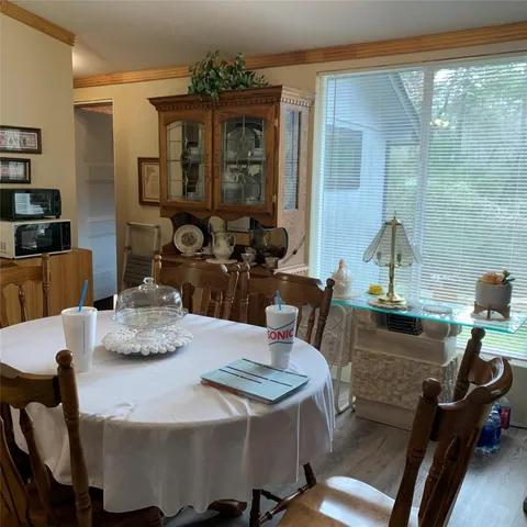 a view of a dining room with furniture window and outside view