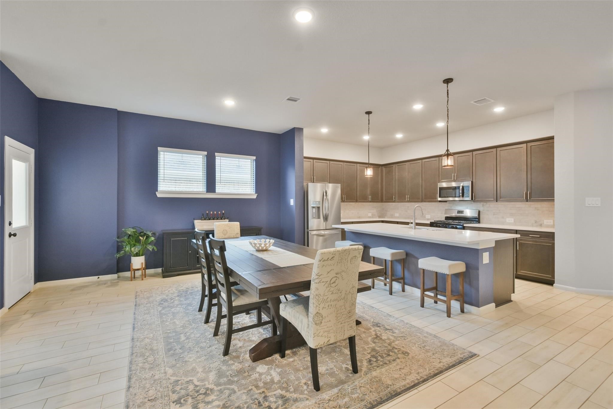 42533 Summer Crest Road Magnolia, TX 77354 - Photo 7 of 28 Accent walls add depth to the dining area.