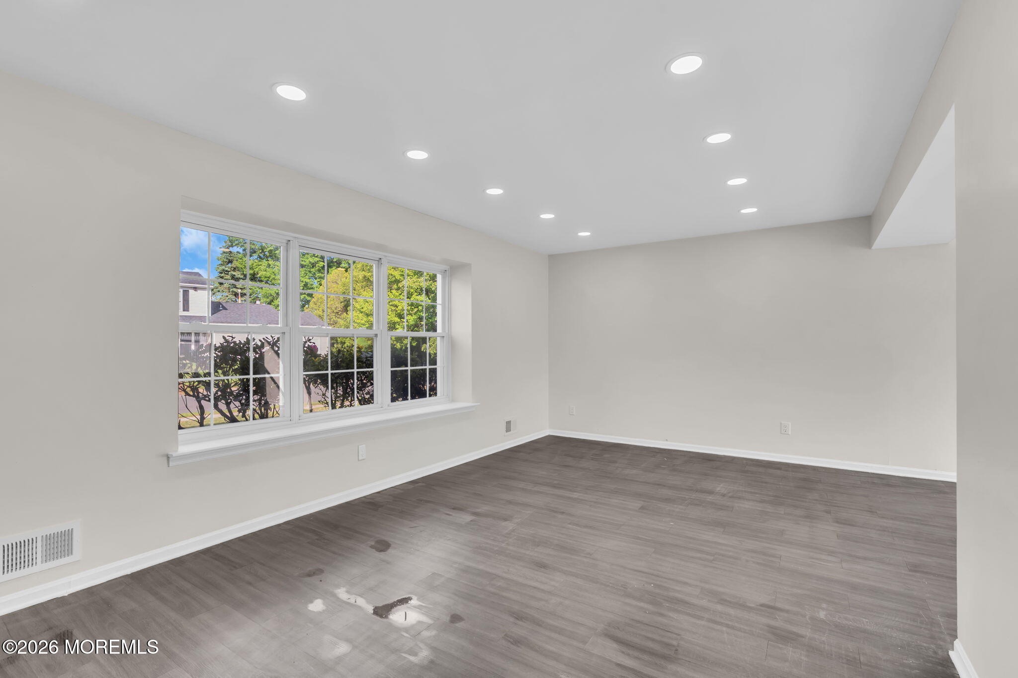 45 Peachstone Road Howell, NJ 07731 - Photo 40 of 54 a view of an empty room with wooden floor and a window