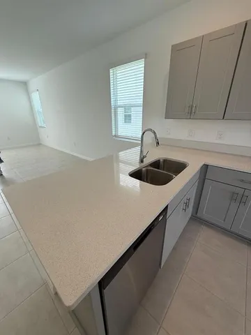 a kitchen with a sink and cabinets
