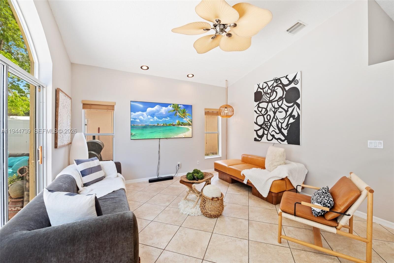 955 Azure Lane Weston, FL 33326 - Photo 11 of 34 a living room with furniture and a ceiling fan