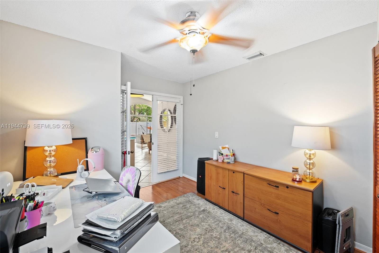955 Azure Lane Weston, FL 33326 - Photo 17 of 34 a bedroom with furniture and a window