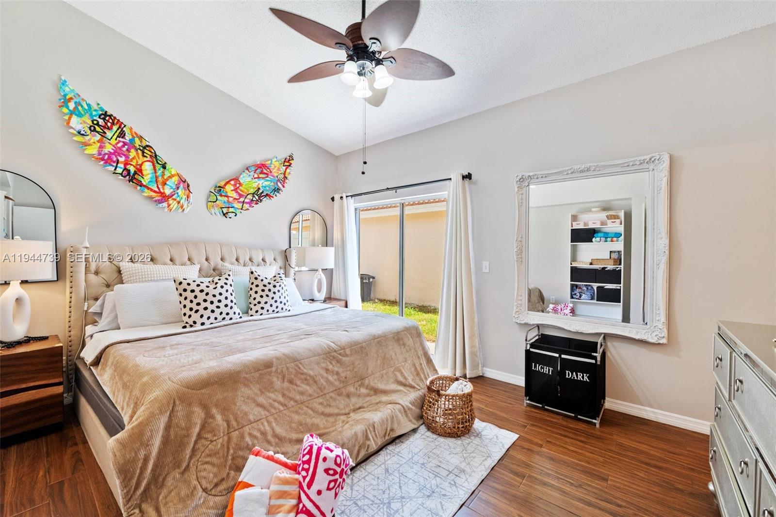 955 Azure Lane Weston, FL 33326 - Photo 18 of 34 a bedroom with a bed dresser and a window
