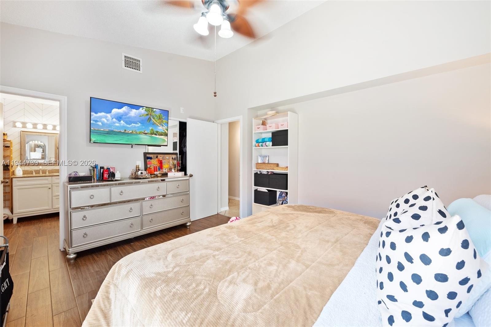 955 Azure Lane Weston, FL 33326 - Photo 19 of 34 a bed room with a bed and a television