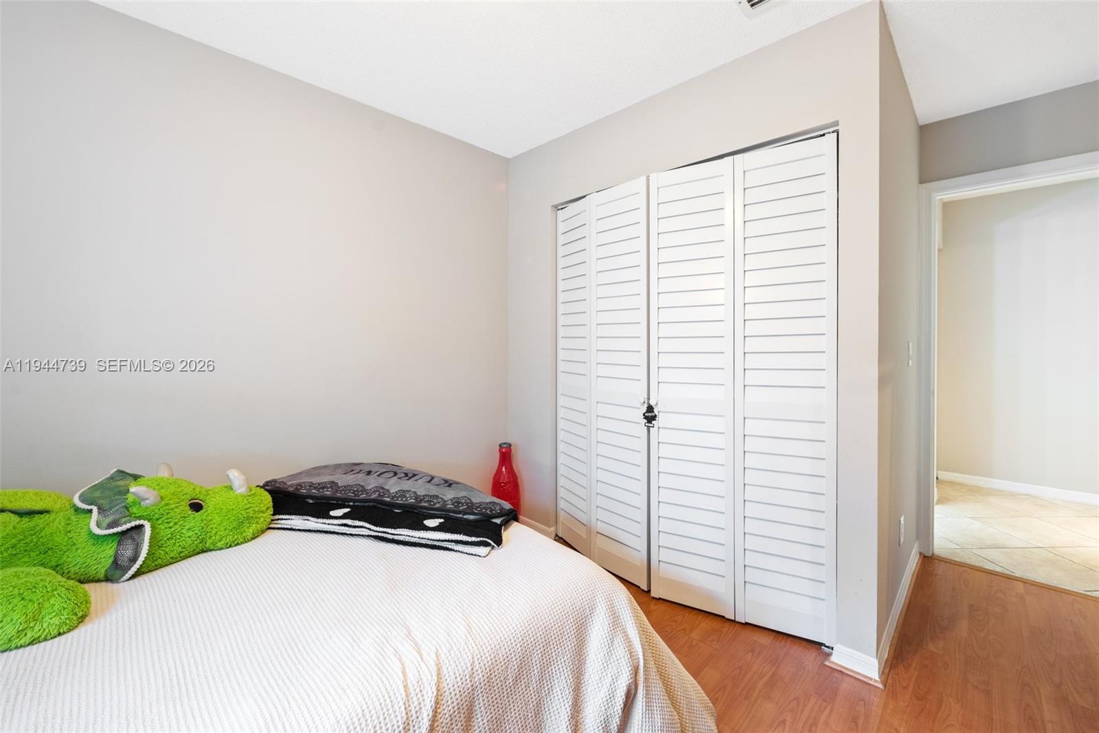 955 Azure Lane Weston, FL 33326 - Photo 22 of 34 a bedroom with a bed and a window