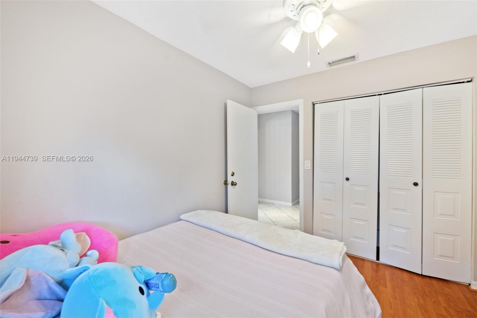 955 Azure Lane Weston, FL 33326 - Photo 24 of 34 a bedroom with a bed and a window