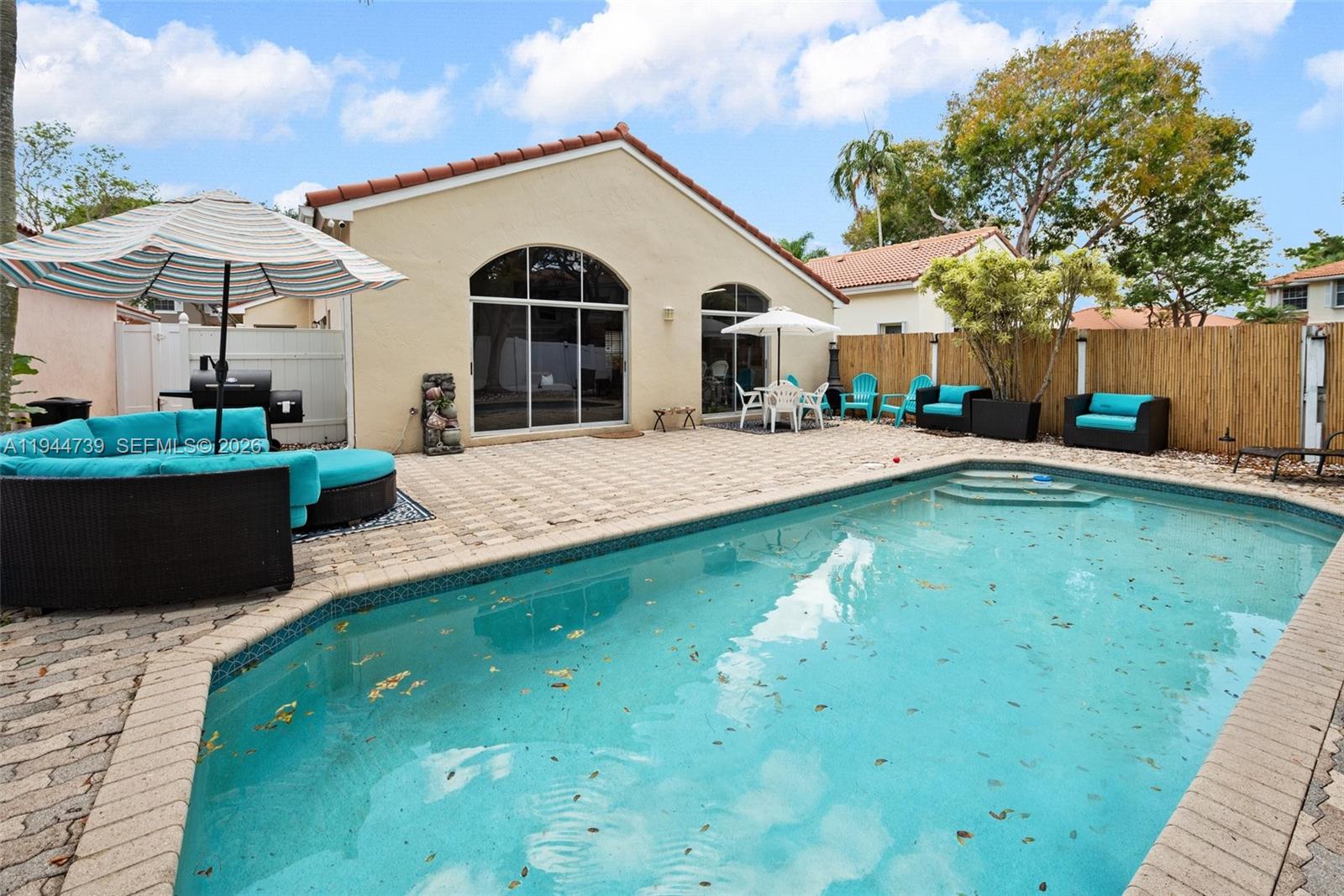 955 Azure Lane Weston, FL 33326 - Photo 28 of 34 a front view of a house with a yard