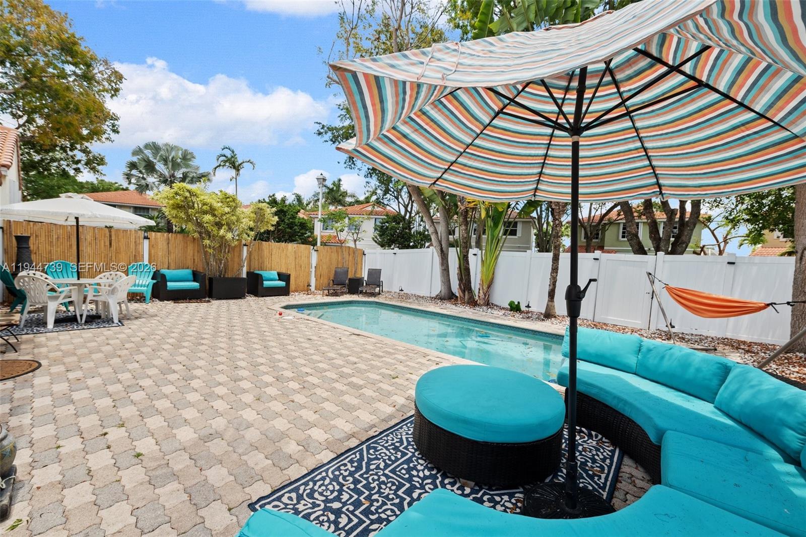 955 Azure Lane Weston, FL 33326 - Photo 30 of 34 a view of a house with backyard and sitting area