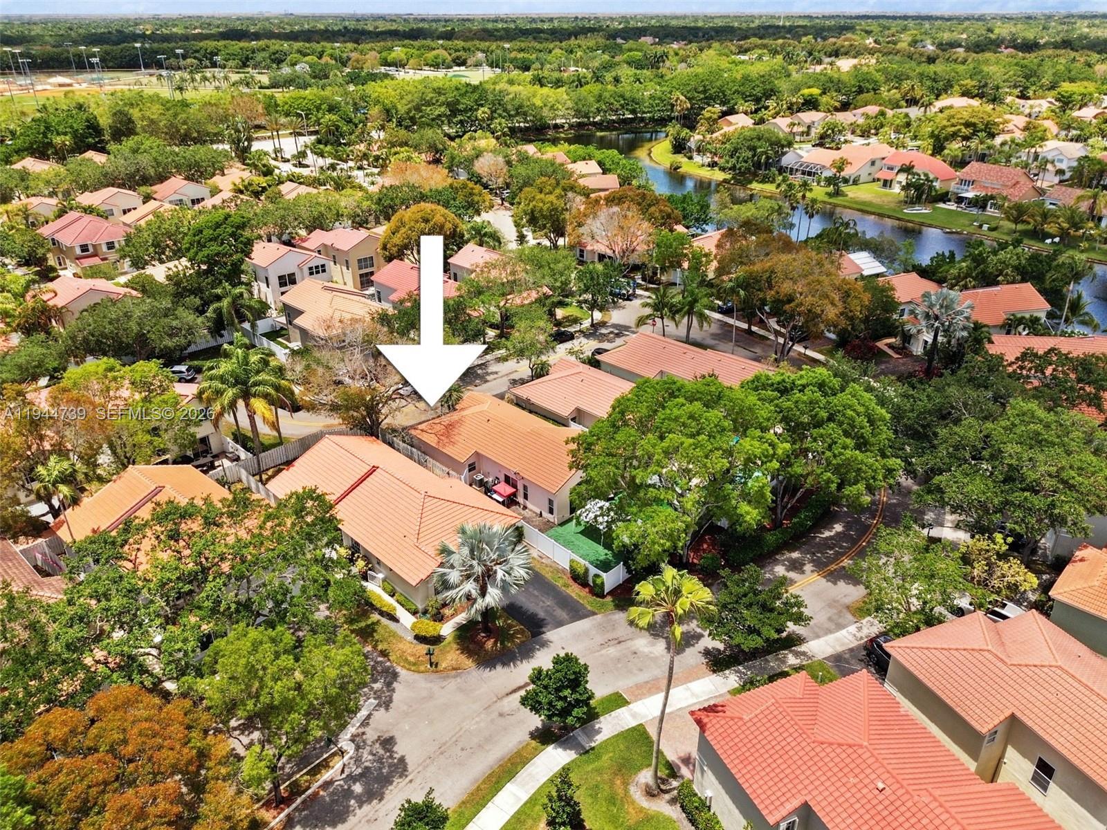 955 Azure Lane Weston, FL 33326 - Photo 32 of 34 an aerial view of residential houses with outdoor space