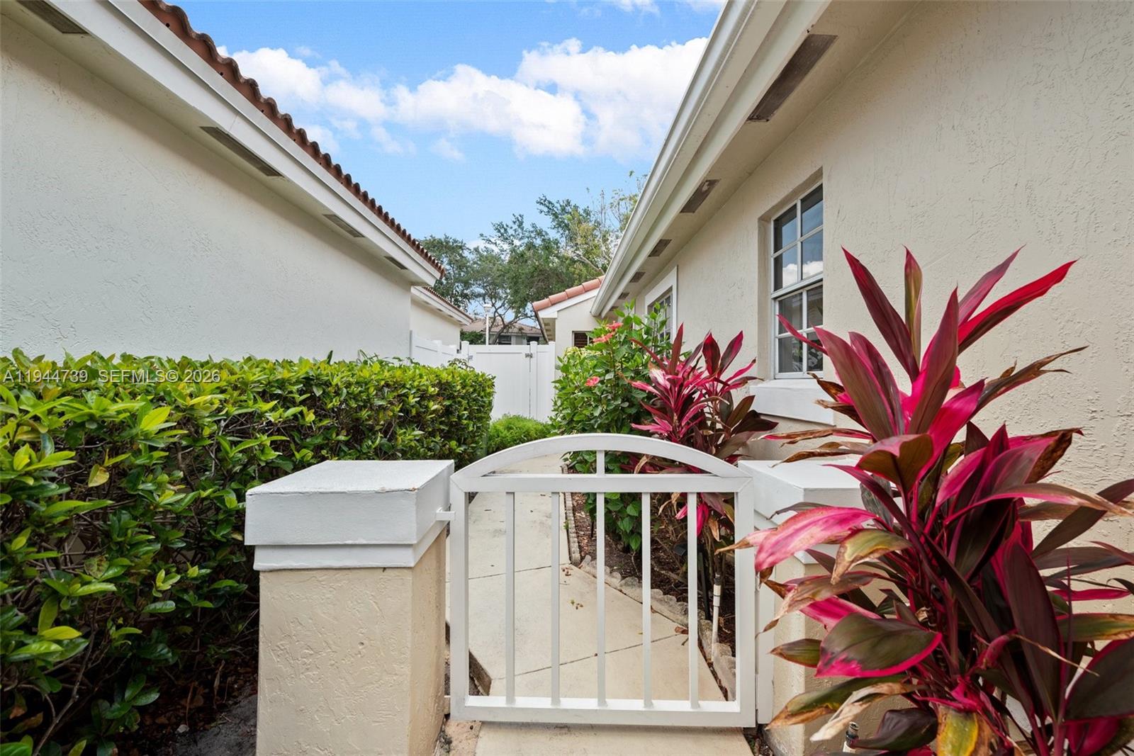 955 Azure Lane Weston, FL 33326 - Photo 4 of 34 a front view of a house with a garage