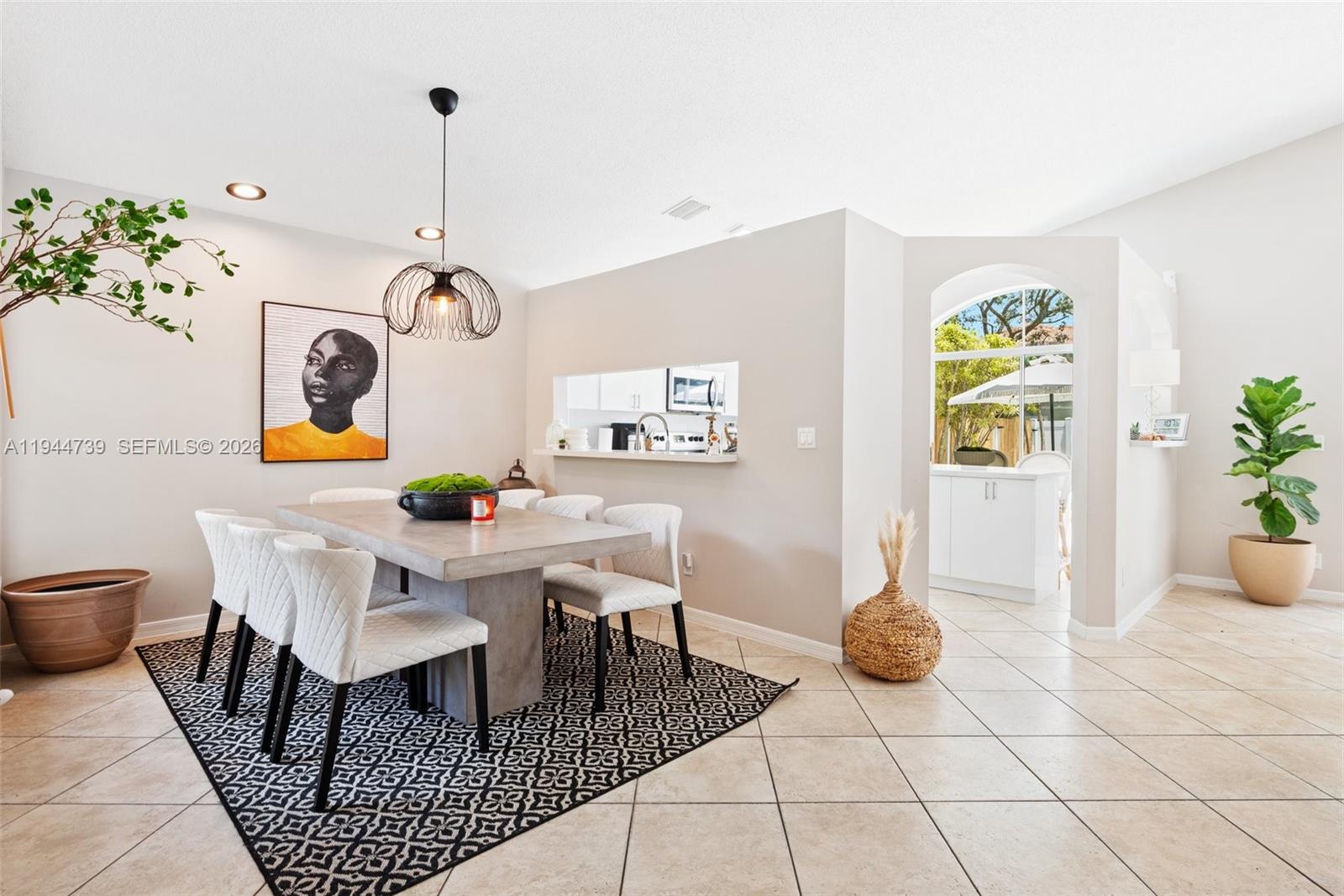 955 Azure Lane Weston, FL 33326 - Photo 7 of 34 a view of a dining room with furniture