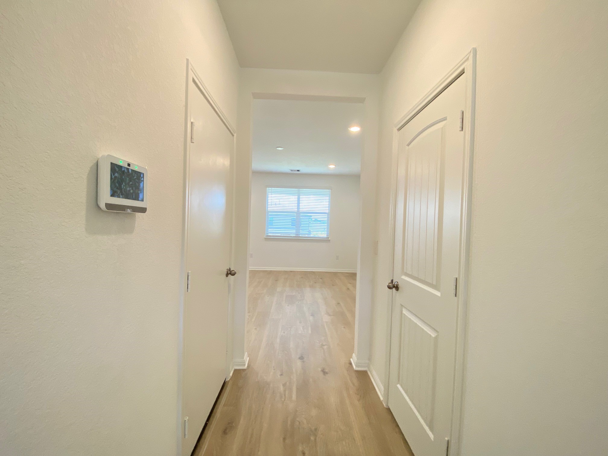 205 Saide Street Georgetown, TX 78626 - Photo 11 of 31 a view of a hallway with wooden floor