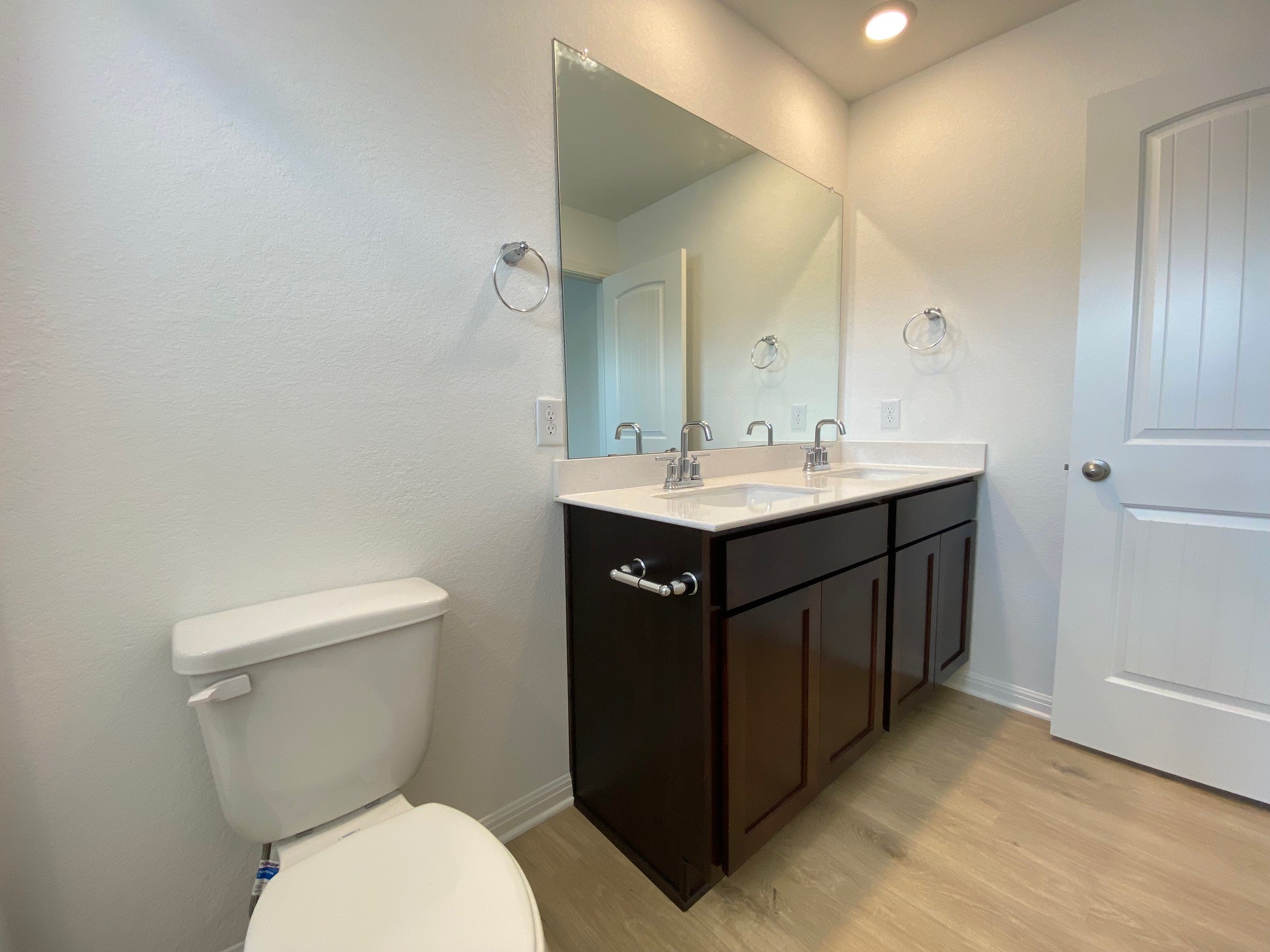 205 Saide Street Georgetown, TX 78626 - Photo 5 of 31 a bathroom with a toilet a sink and mirror