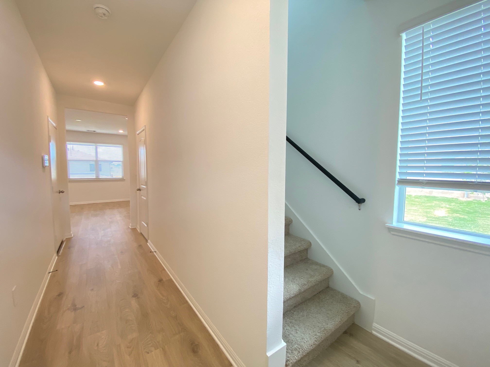 205 Saide Street Georgetown, TX 78626 - Photo 10 of 31 a view of hallway with window and wooden floor