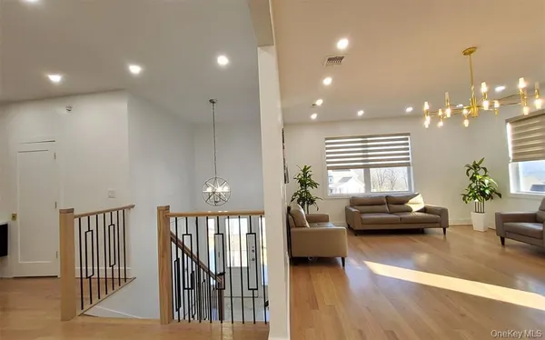 a view of a hallway with a chandelier