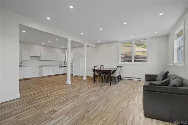 a large kitchen with kitchen island a sink stainless steel appliances and cabinets