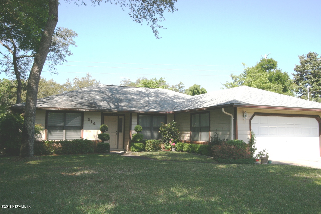 514 Gentian Road St. Augustine, FL 32086 - Photo 1 of 22 a front view of a house with garden