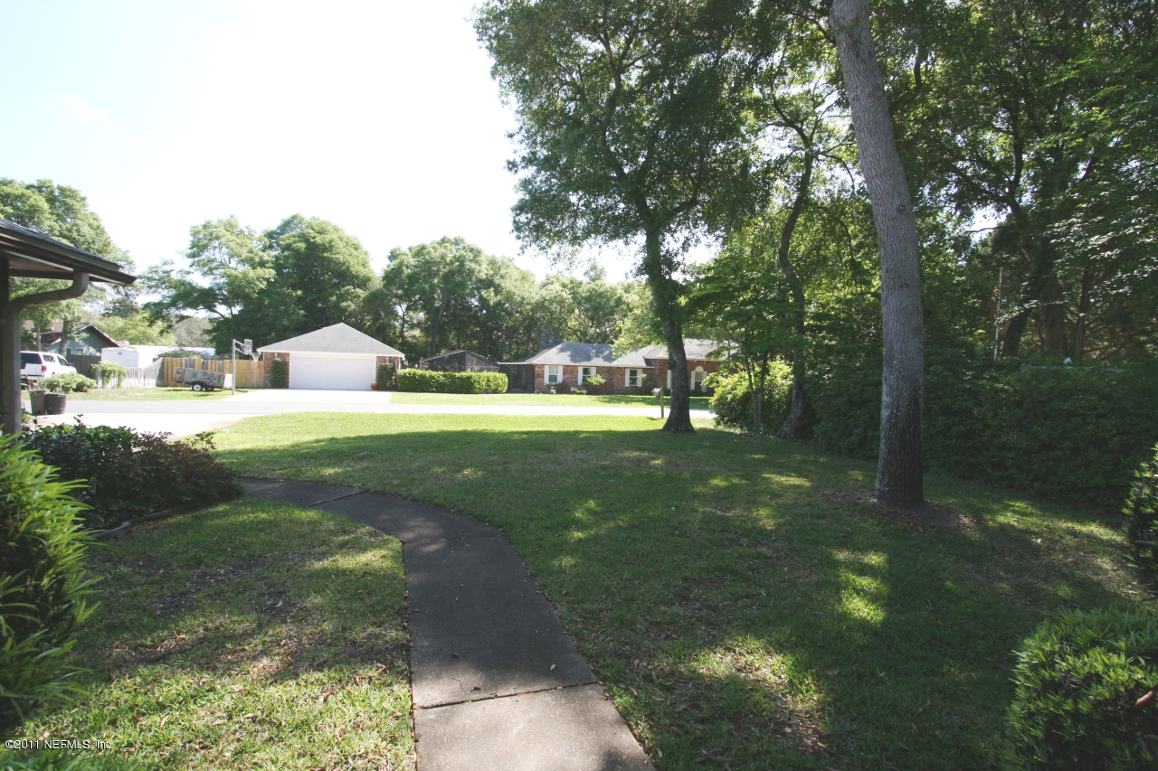 514 Gentian Road St. Augustine, FL 32086 - Photo 3 of 22 a view of yard with tree s