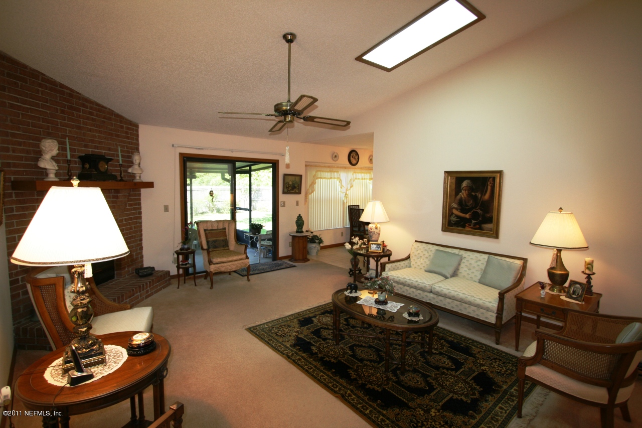 514 Gentian Road St. Augustine, FL 32086 - Photo 8 of 22 a living room with furniture and a table