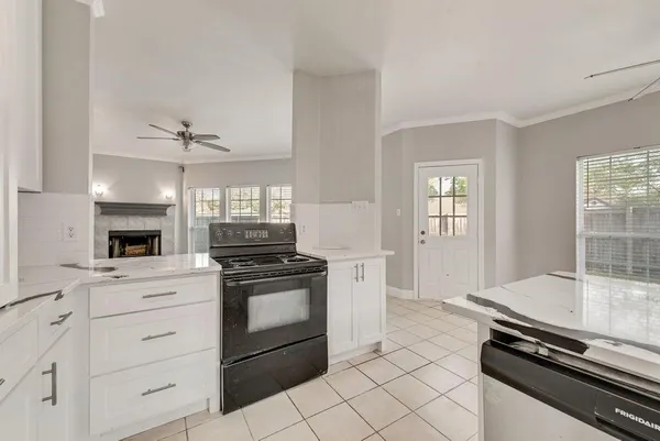 a kitchen with stainless steel appliances a refrigerator sink and stove