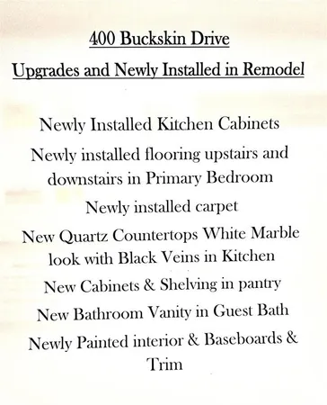 a view of a backyard with fence