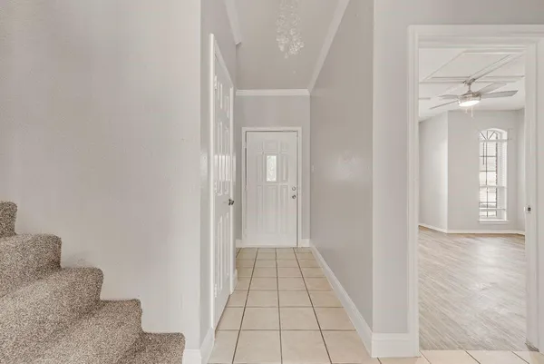 a view of a hallway view with wooden floor and staircase