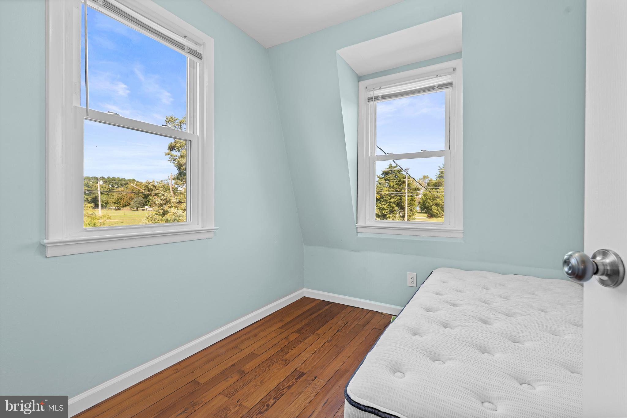 17203 Piney Point Road Piney Point, MD 20674 - Photo 25 of 43 a view of a small space with wooden floor and a window