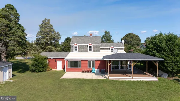 a aerial view of a house with a yard